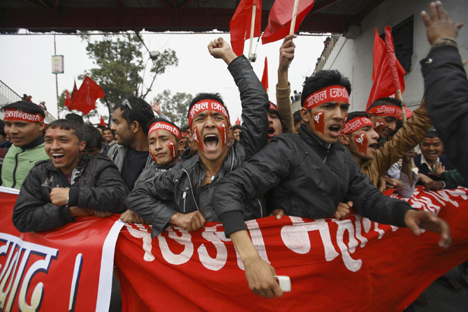 Supporters of Unified Communist Party of Nepal (UCPN-Maoist) participate during a rally marking the 17th anniversary of the "People's War" in Kathmandu February 13, 2012. According to local media, thousands of communist supporters gathered for a mass meeting at the Open Air Theatre. The UCPN-Maoist started the war on February 13, 1996 demanding for the end of the monarchy, as well as for an election to the Constituent Assembly. REUTERS/Navesh Chitrakar (NEPAL - Tags: POLITICS CIVIL UNREST ANNIVERSARY)